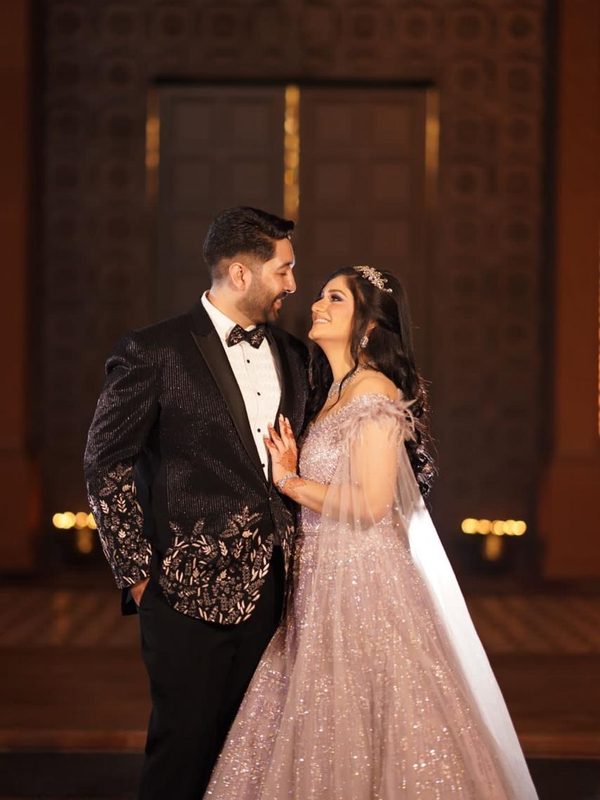 The couple standing close, looking into each other’s eyes.